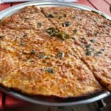 Pizzeria With Two Long Island Locations Praised For 'Paper-Thin Crust'