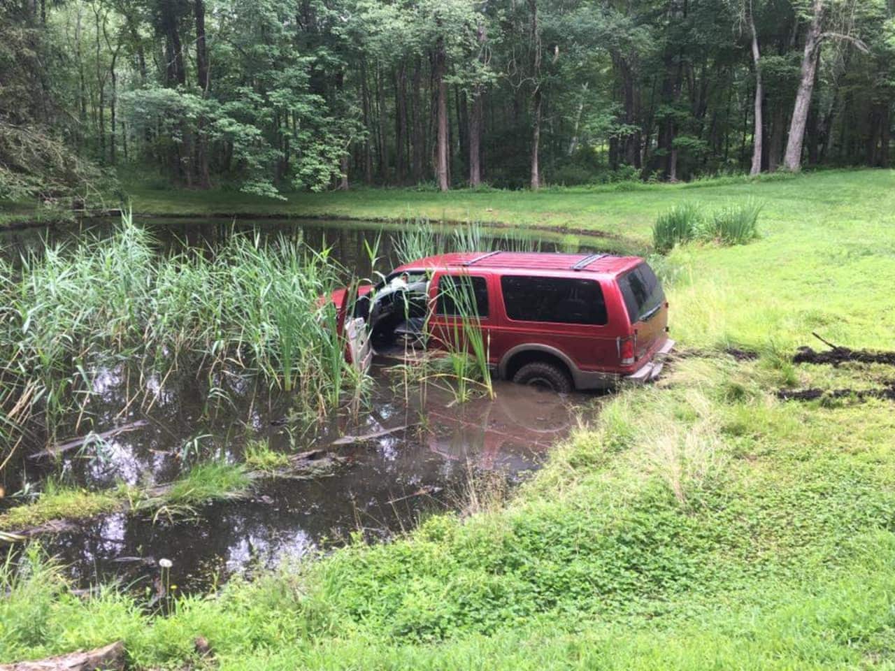 A look at the SUV submerged in the pond off Route 121 near the Ward Pound Ridge Reservation.