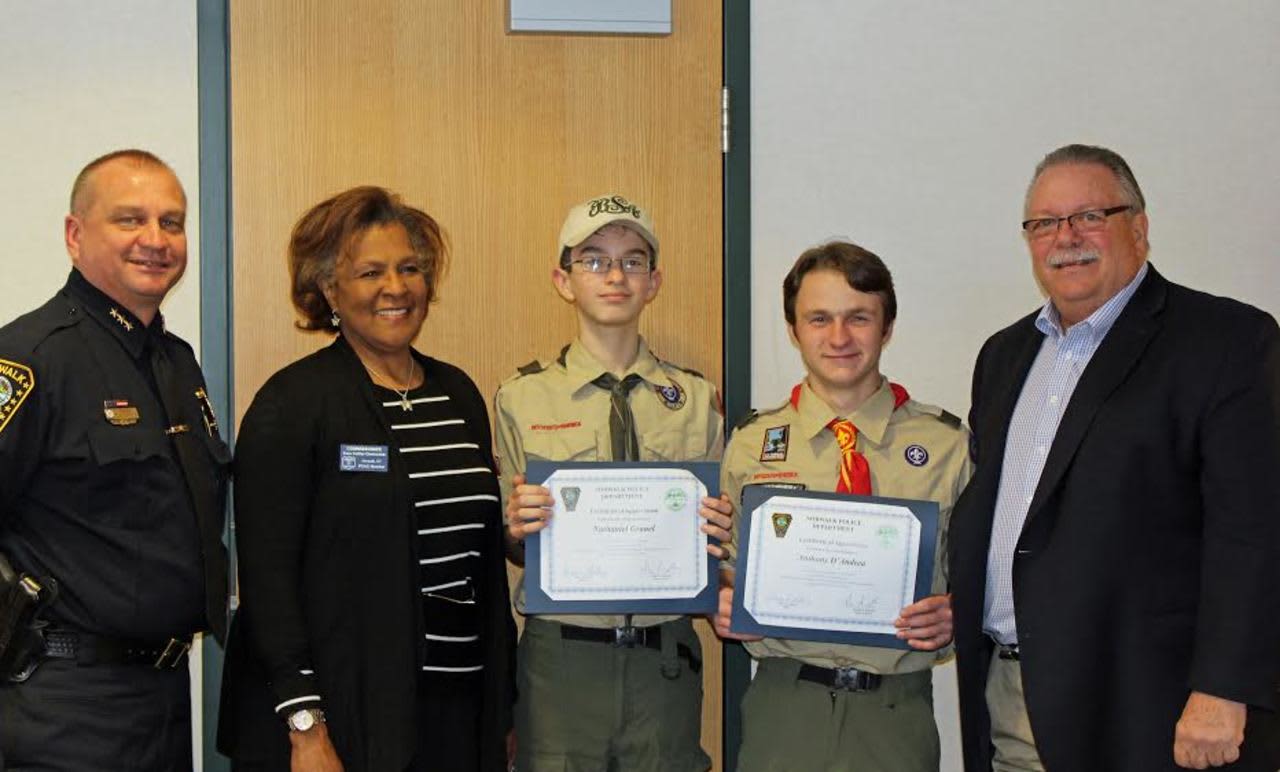 From left: Police Chief Thomas Kulhawik, Commissioner Fran Collier-Clemons, First Class Scout Nathaniel Grauel, Life Scout Anthony D’Andrea and Commissioner Charles Yost.