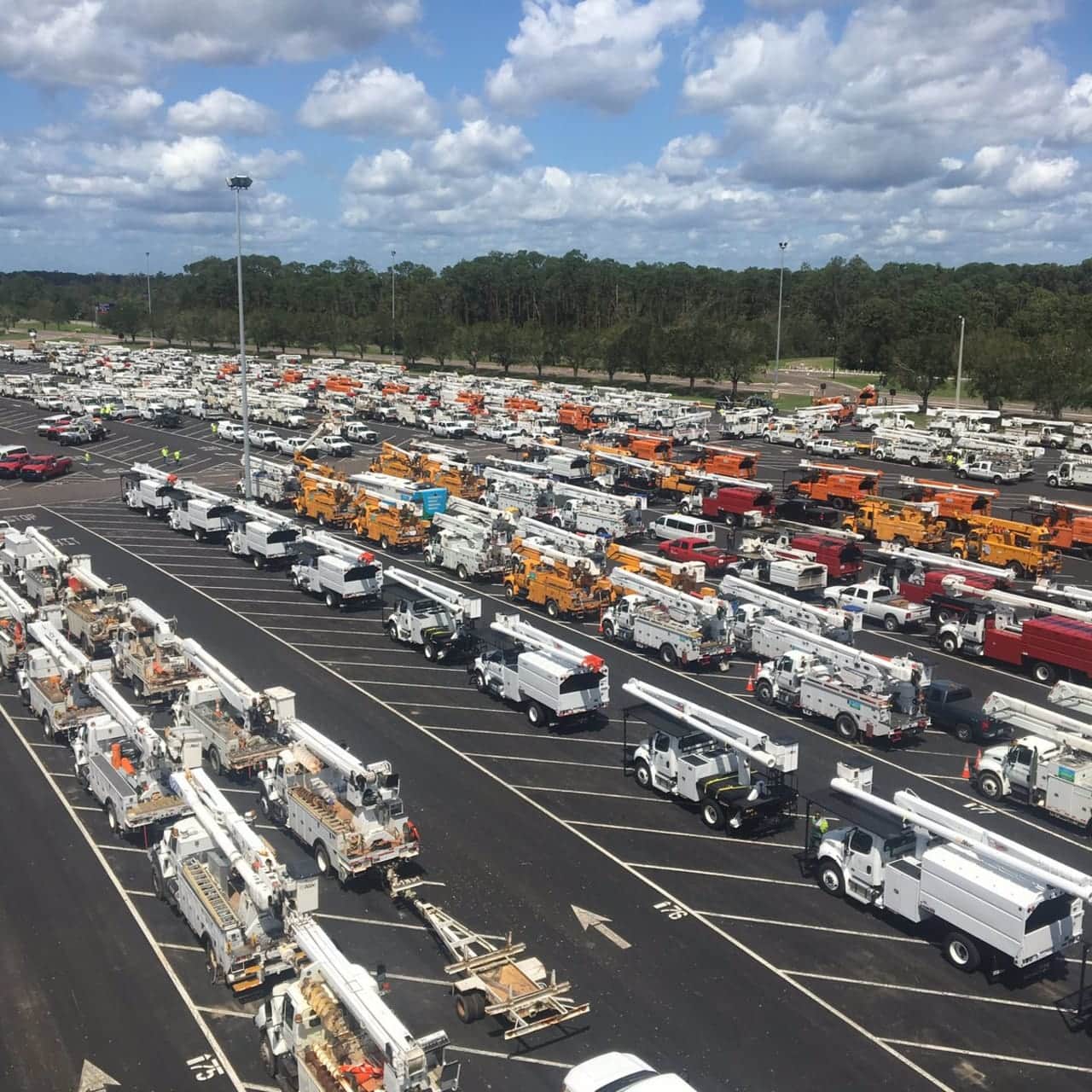 A convoy of 70 trucks from Eversource arrive Tuesday in Orlando to help restore power after Hurricane Irma.