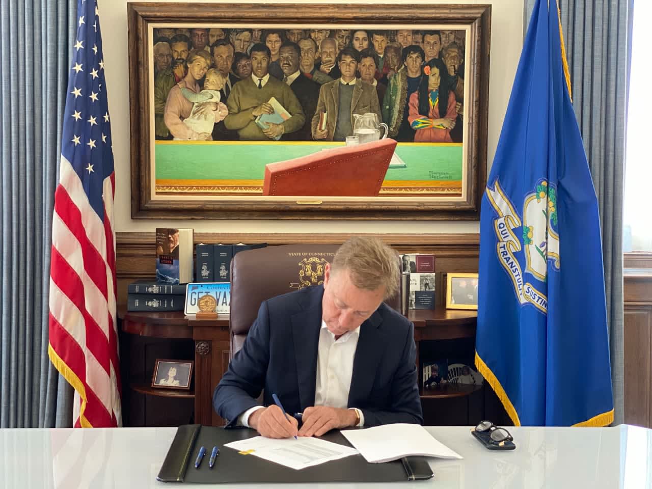 Ned Lamont signing a bill into law.