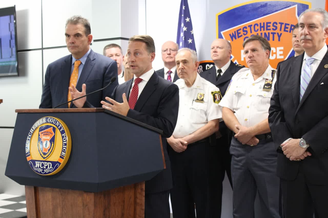 County Executive Rob Astorino is flanked by police chiefs and District Attorney Anthony Scarpino outline a new task force to combat opioid abuse.