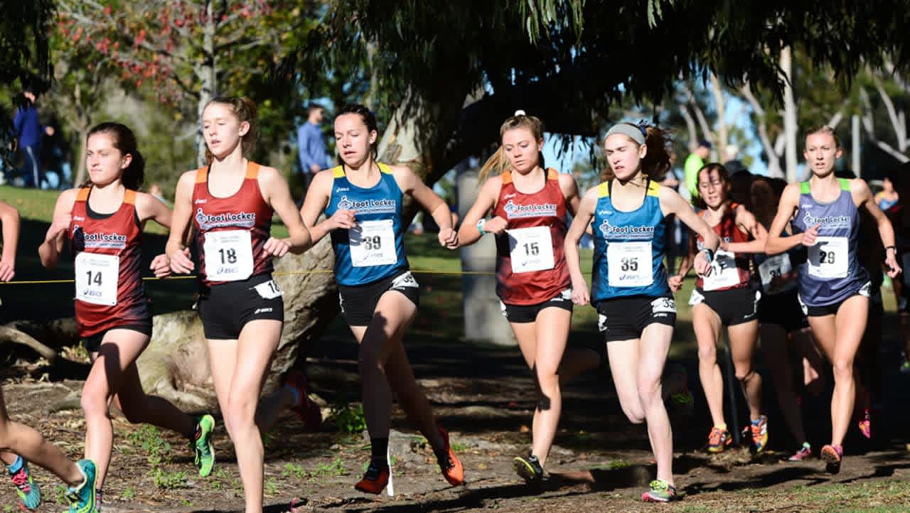 Westport's Hannah DeBalsi, No. 14, runs with a pack of girls at Saturday's Foot Locker cross country national championships in San Diego. 