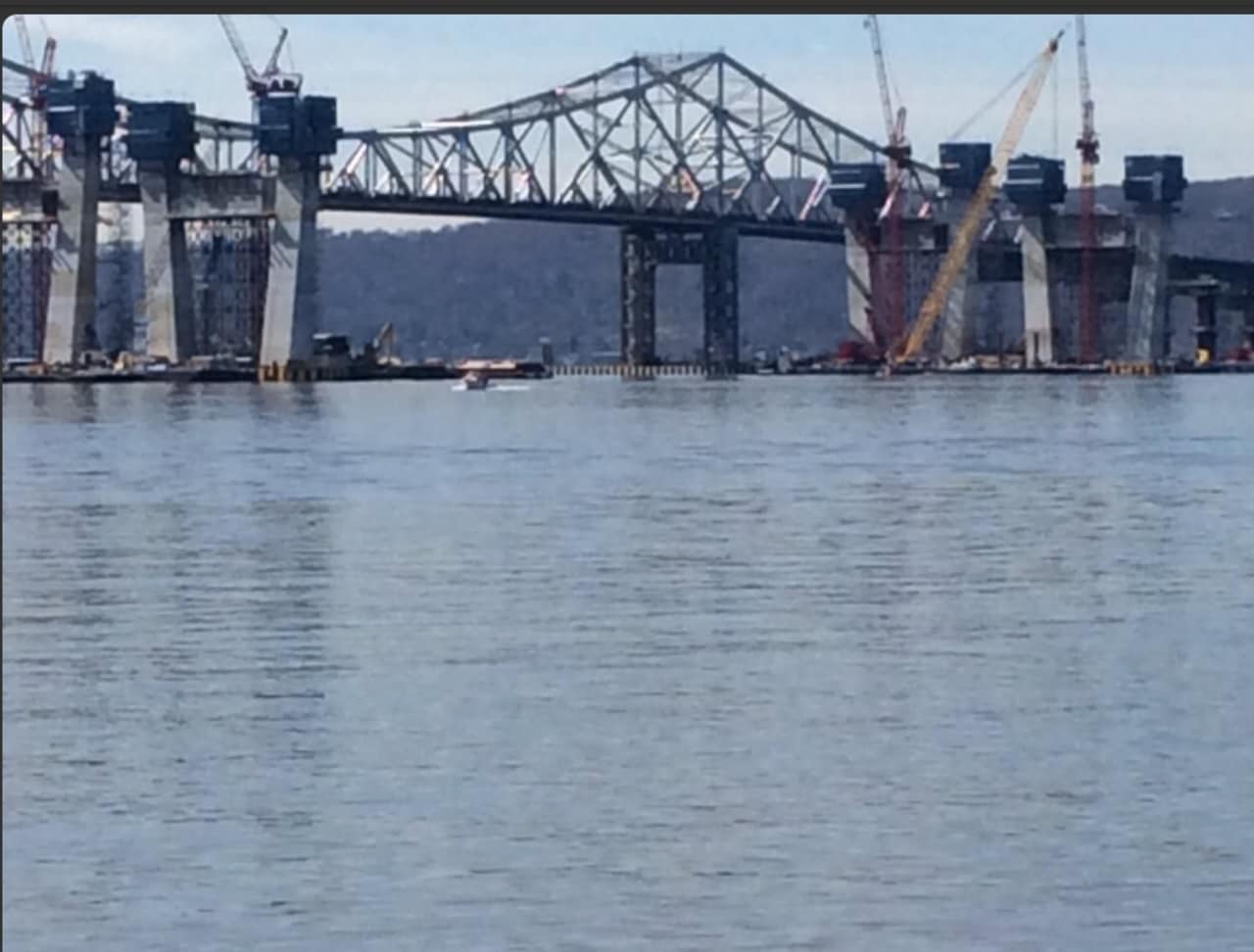 Crews will use a mammoth salvage crane to try to raise the tugboat that crashed into a barge near the Tappan Zee Bridge project, killing three crew members. The bodies of two of the victims have been recovered; the third is still inside the vessel.