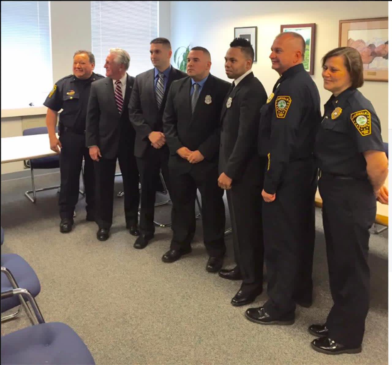 From left, DC Gonzalez, Norwalk Mayor Harry Rilling, Officer Brian Hamm, Officer Jaime Acosta, Officer Ariel Martinez, Chief Kulhawik and DC Zecca at the swearing-in ceremony.