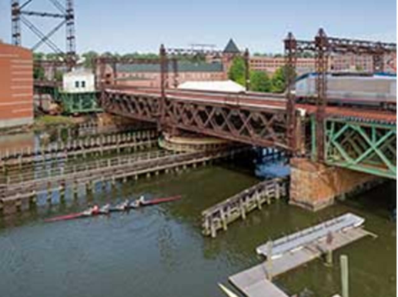 The Walk bridge carries Metro-North and Amtrak trains over the Norwalk River at the mouth of the Norwalk Harbor. It swings open to allow marine traffic to pass through.