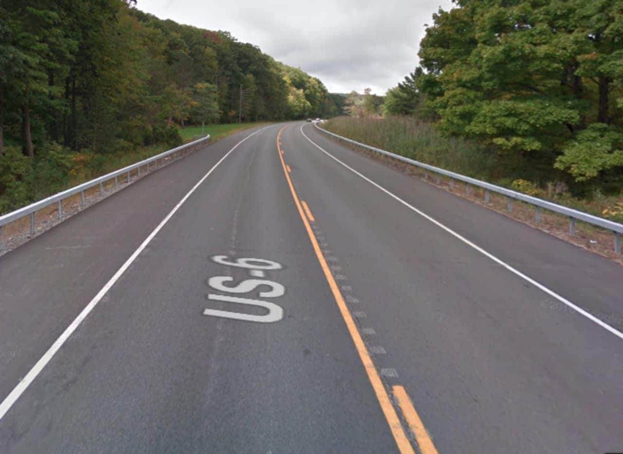 A Rockland County corrections officer was shot in the head while driving his car along Route 6.