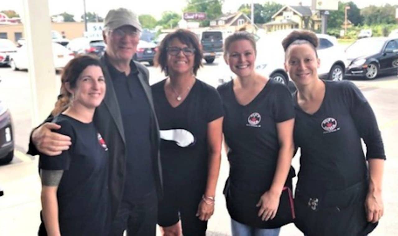 Actor Richard Gere poses for a photo with the staff at Julie's Diner on Saturday. From left, Jeanette Bova, Gere, diner owner Kristen Macko, Megan Skinner and Jen Cruz.