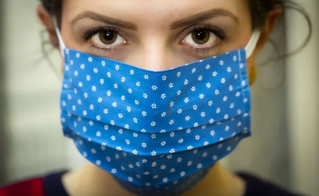 Federal officials are reviewing their recommendations on wearing face masks in public to prevent the spread of COVID-19.