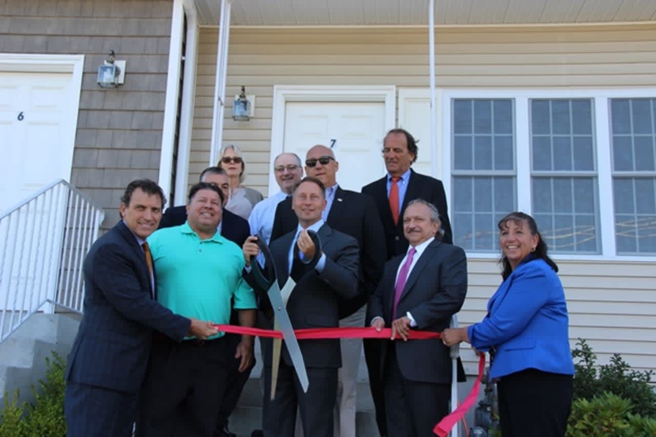 Westchester County Executive Rob Astorino cuts the ribbons on the county's newest affordable housing unit.