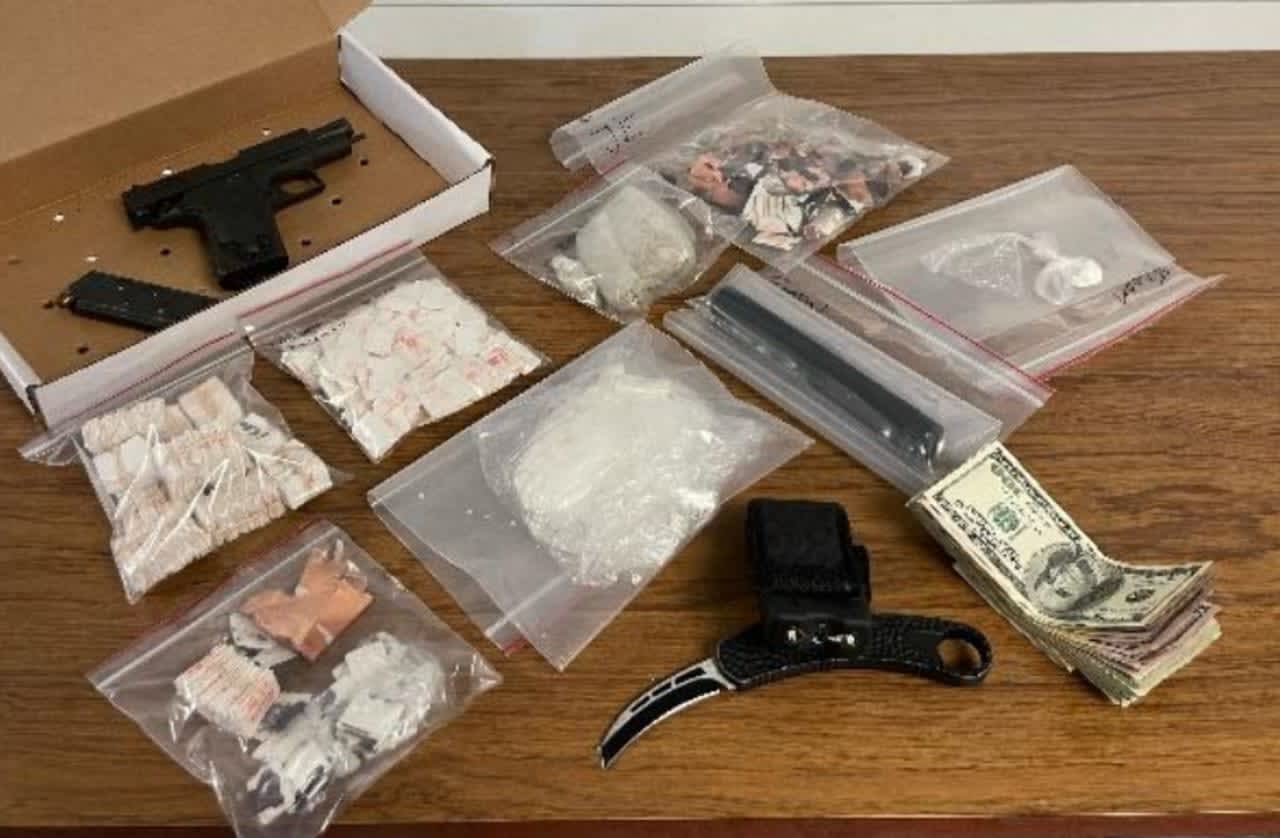 The recovered drugs and handgun.