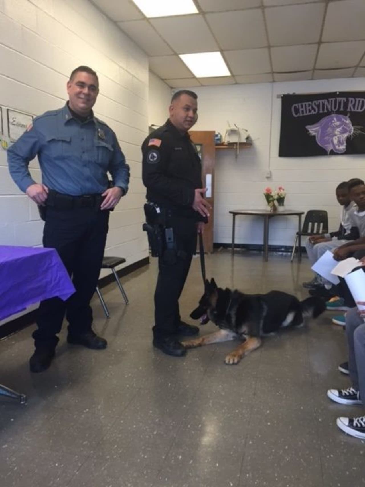 Ramapo police officers Omar Olayan, Andres Sanchez and K-9 partner, Rookie pay a Career Day visit to Chestnut Ridge Middle School.