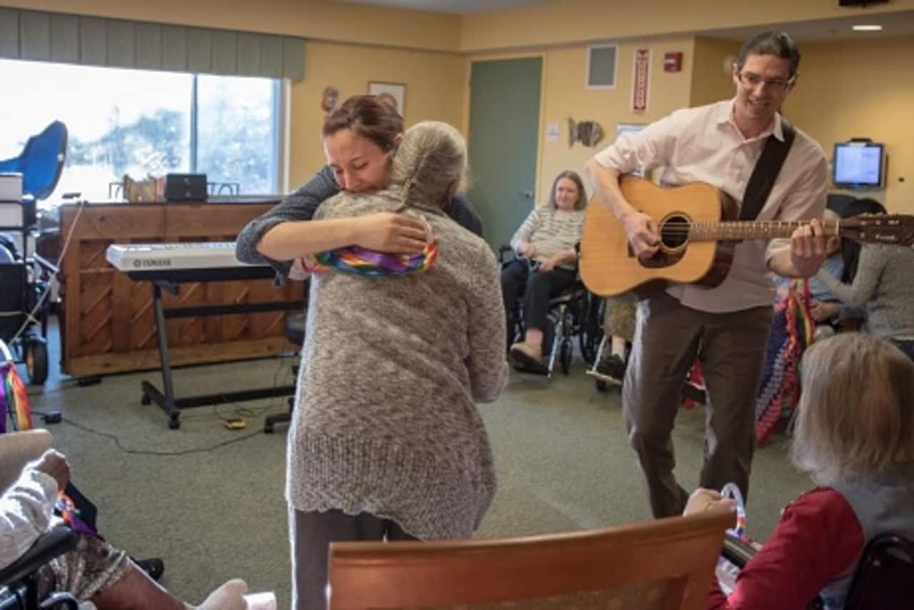 Michael LaHue, a music therapist at United Hebrew of New Rochelle, right, says music is not only soothing, it helps residents connect with themselves, their memories, and their families.