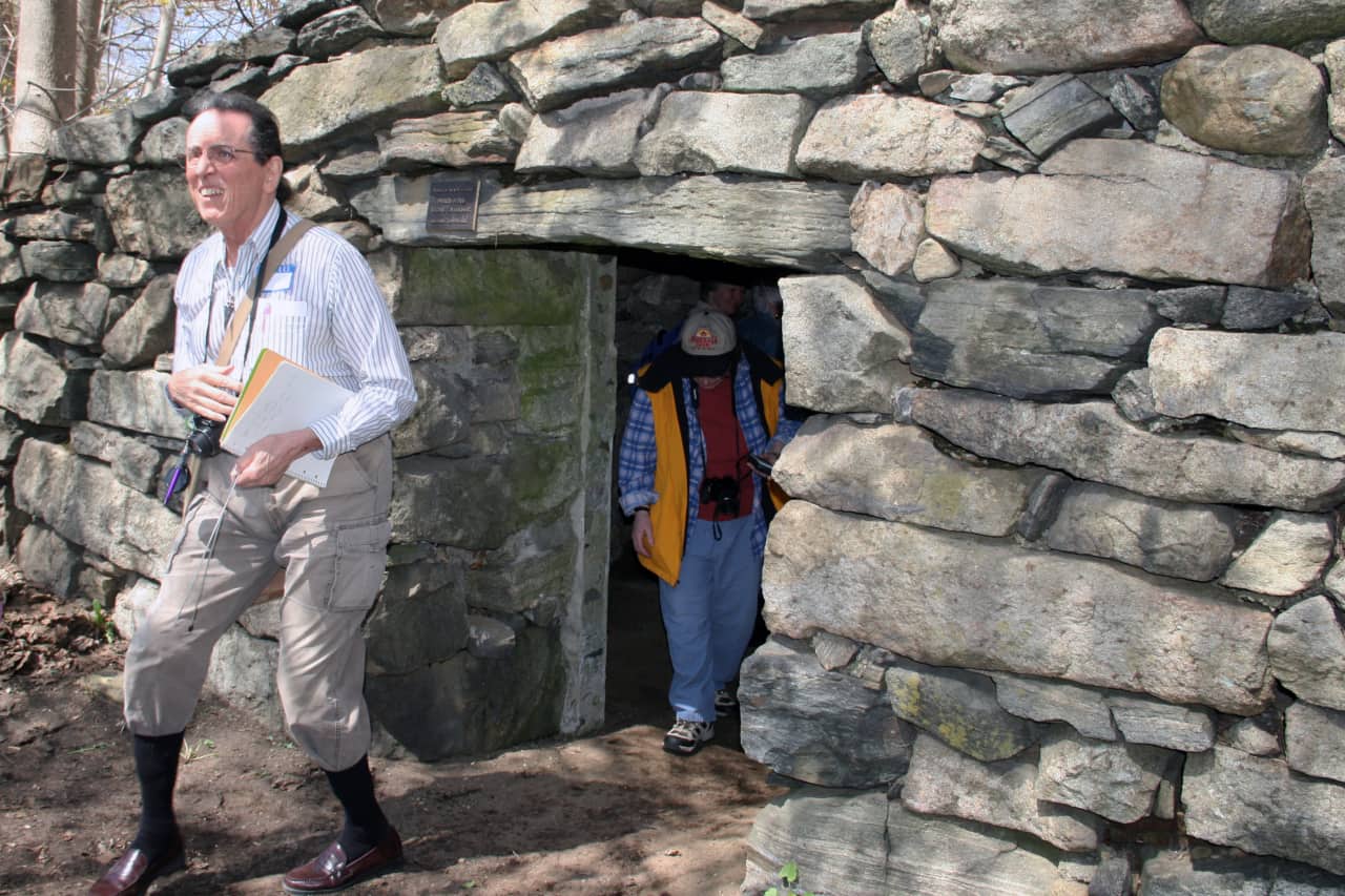Archeological researcher David Johnson (left) conducted a tour of North Salem's stone chambers and cairns.