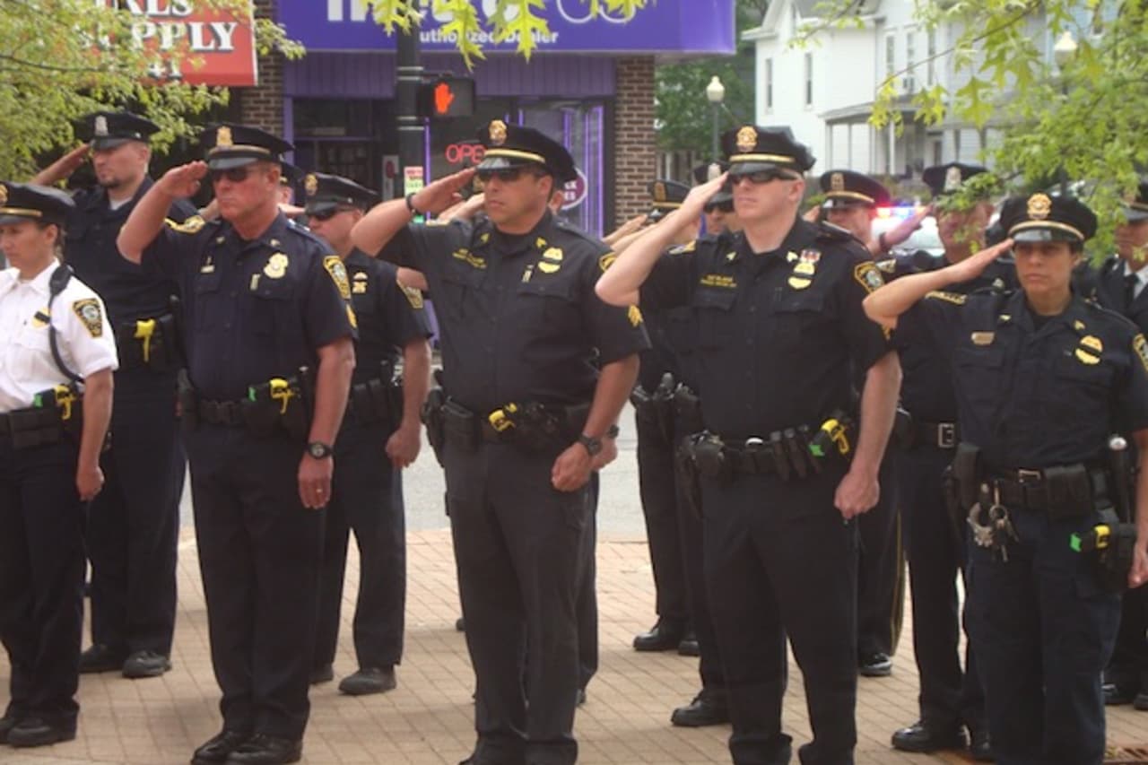 Officers of the Norwalk Police Department salute in honor of those who have died in the line of duty. To celebrate the week of May 15 as National Police Week, the Norwalk Police Department is hosting a Police Memorial Service on Wednesday, May 18.