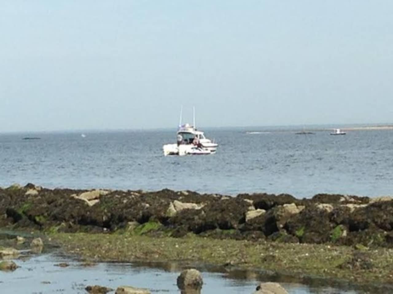First responders search the waters of Long Island Sound off Norwalk for a missing boater on Monday. 