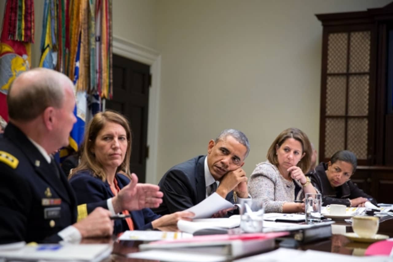 President Barack Obama meets with members of his national security team and senior staff to receive an update on the Ebola outbreak in West Africa in the Roosevelt Room of the White House on Monday.