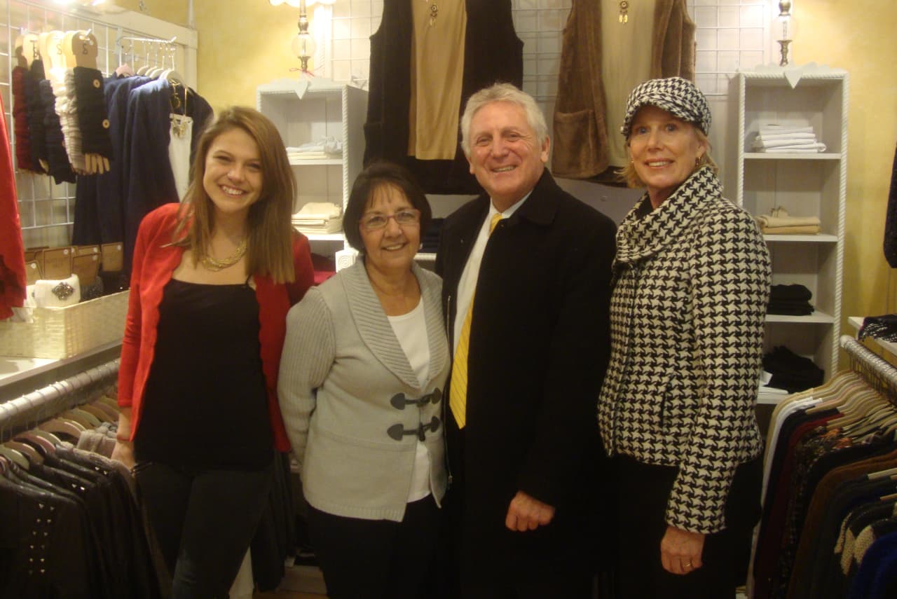 Eliza Ungemack and Connie Brown of Connie B's on Washington Street with Mayor Harry Rilling and Elizabeth Stocker as the Norwalk officials promote local shopping during last year's Small Business Saturday.