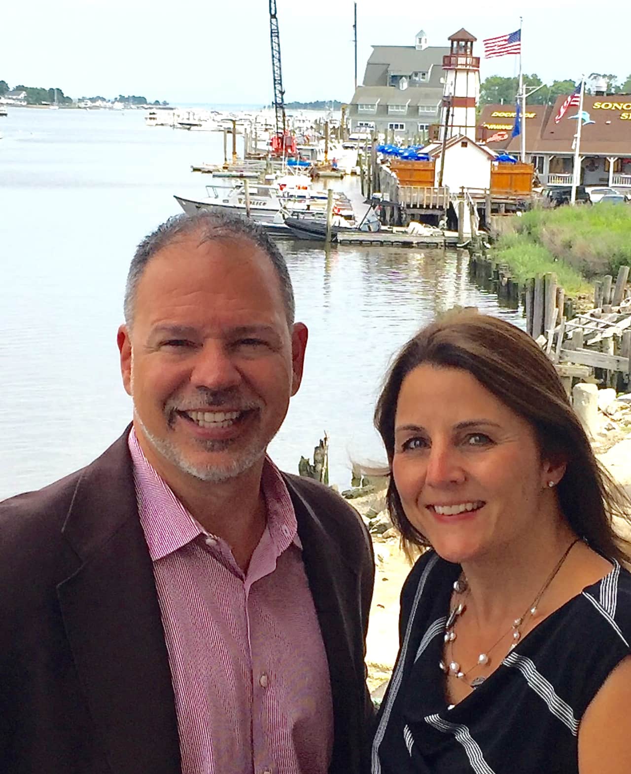 Paul Zullo, managing director and co-founder and Donna Bonato, creative director and co-founder from the deck of their new office overlooking Norwalk Harbor.