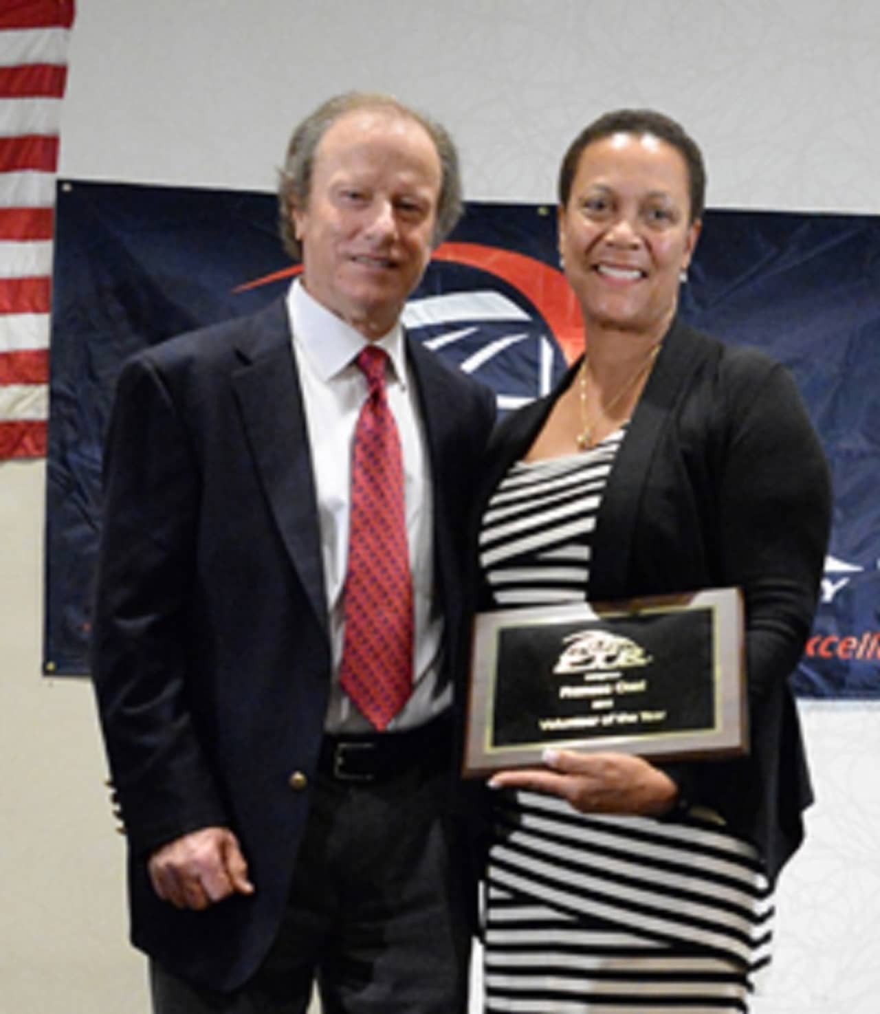 Fran Osei is shown in 2015 with Roy Barth, president, Professional Tennis Registry when she was named the registry's Volunteer of the Year.