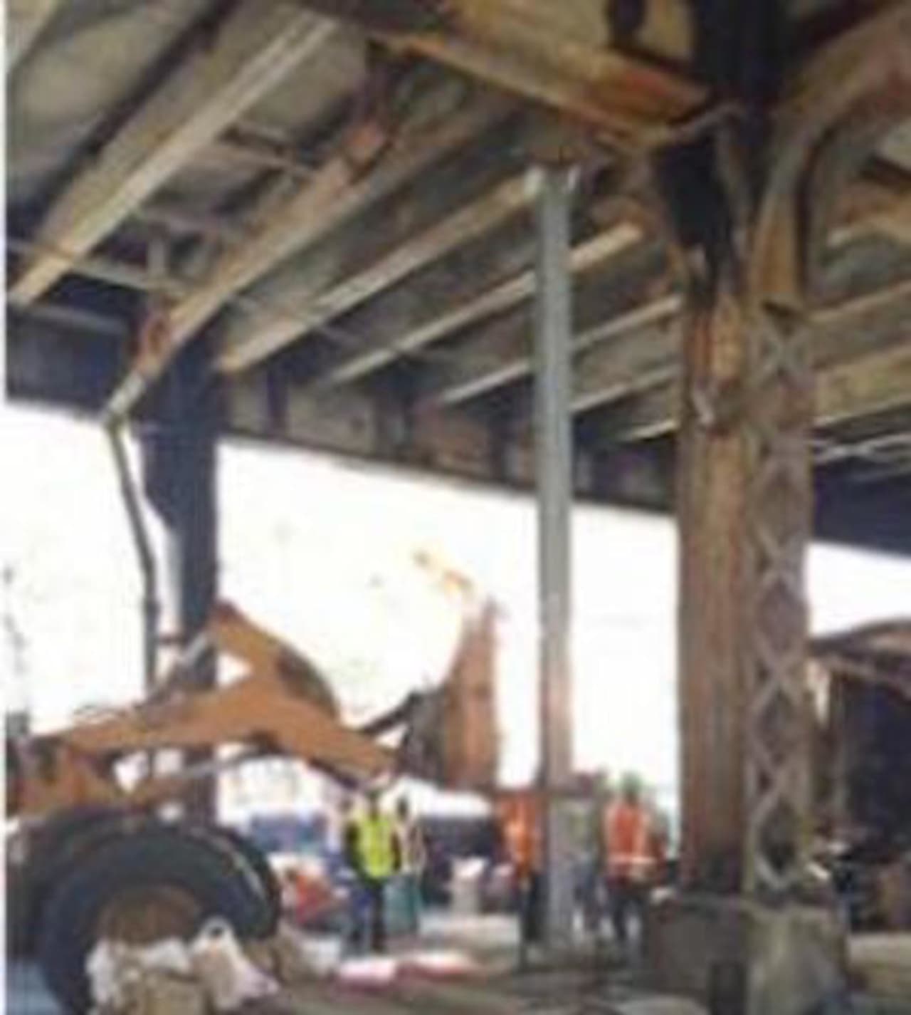 Metro-North crews work Wednesday to repair damage to the Viaduct after a fire Tuesday.