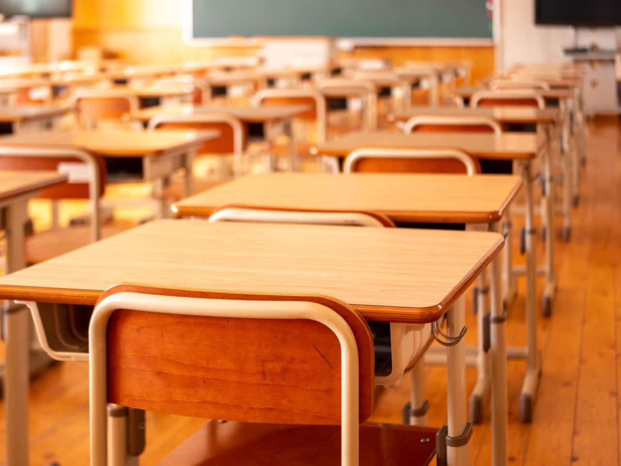 A dozen students and two teachers in Connecticut experienced watery eyes and scratchy throats after a classroom was contaminated with a defensive spray, school officials said.