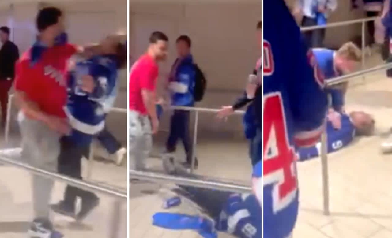 New York Rangers fan sucker-punches Tampa Bay Lightning fan after the visitors' 3-1 Stanley Cup semi-finals win at Madison Square Garden.
