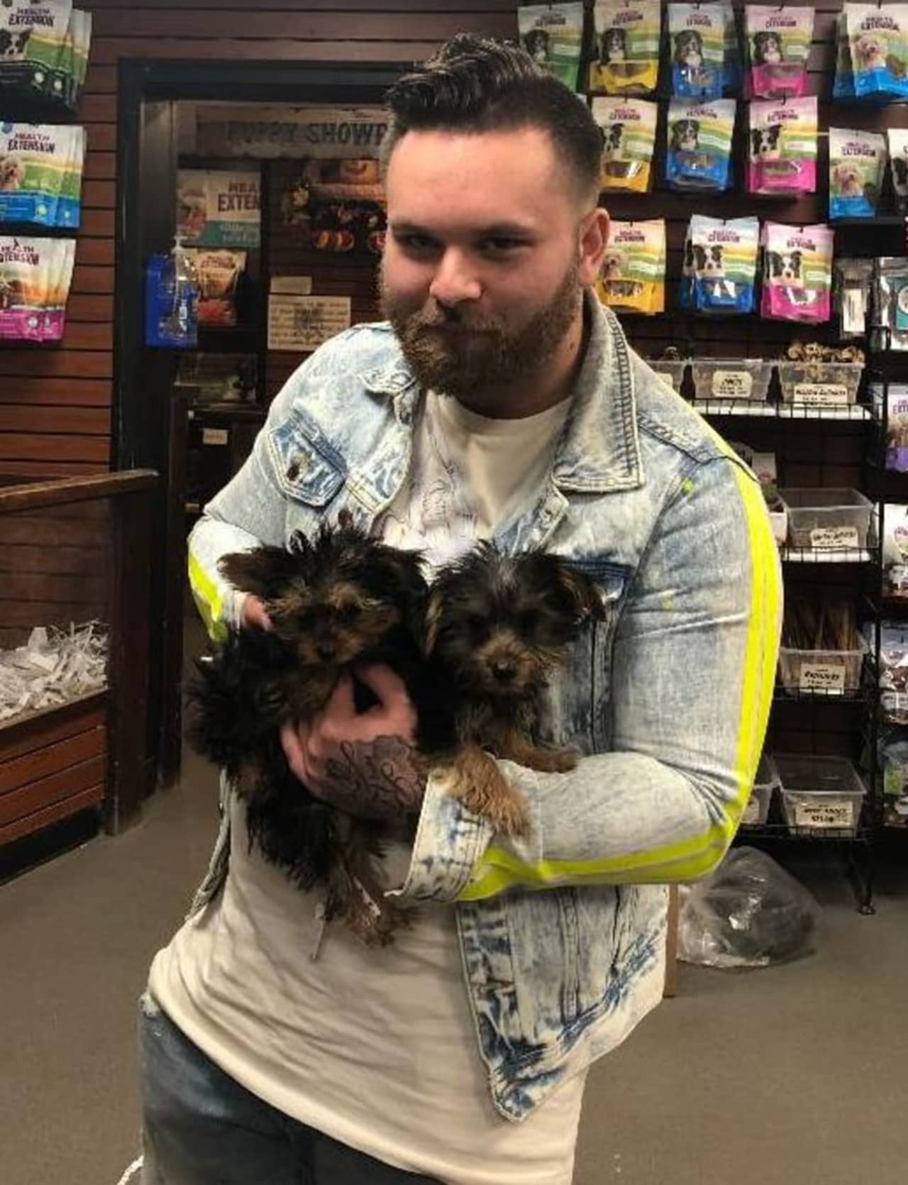 A man is wanted for allegedly using stolen information to purchase puppies in Huntington Station.