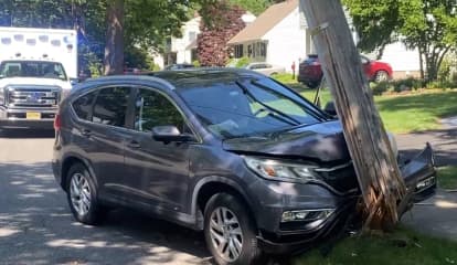 SUV Driver Hospitalized After Shattering Utility Pole In Ridgewood