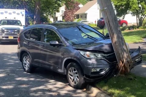SUV Driver Hospitalized After Shattering Utility Pole In Ridgewood
