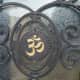 Engraving of the "Om" symbol on the front door.
