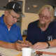 John Opatovsky, right, helps a veteran fill out disability paperwork for the VA at the Bergenfield headquarters of Disabled American Veterans, Northern Valley Chapter 32.