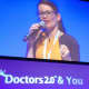 Utitus speaks at a healthcare convention in France.