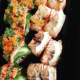 Sushi Metsuyan's Dragon Roll, now the "Metsuyan Roll," and Salmon Roll, made by Head Chef Joe Liu.