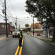 Emerson officials assist PSEG workers with the installation of new utility poles in Kinderkamack Road.