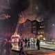 Firefighters from Norwalk, Rowayton, Darien and Stamford battle a raging blaze at a condo complex at 100 Richards Ave. in Norwalk early Monday evening.