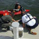 Officers and a medic rescued a boater whose kayak had sunk off the coast of Greenwich this weekend.
