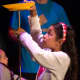 A girl takes part in a circus demonstration at the Tarrytown Music Hall's Family Fun Day