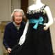 Babs White, costume curator for the Darien Historical Society, prepares for upcoming exhibit, "Mannequins on the Runway, Haute Couture and Contemporary Designs of the 20th Century."