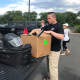 An officer prepares to return his equipment in Hackensack.