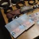 Forged U.S. passports, driver's licenses and other fake credit cards and gift cards recovered this week during a Harrison investigation of three natives of Chile involved in a wider theft ring.