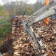 Metro-North crews work to clear a massive woodpile from the tracks in Wilton along the Danbury Branch on Monday.