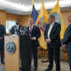 Maron, at right, with various officials at a news conference in Teaneck last Sunday.