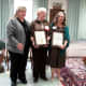 Liz Feldman of the Town of Ossining, left, and Ossining Mayor Victoria Gearity, right, both presented the Dominican Sisters of Hope with proclamations for the Day of Hope in Ossining.