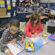 Fourth-graders at the Carrie E. Tompkins Elementary School write letters of thanks to servicemen and women.