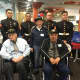 Posing with Marines from MAG49, originating out of Stewart Air Base in Orange County are -- front from left to right -- World War II Marines veterans Tom Perrottof New Rochelle, Sol Brizer of Yonkers and Peter Perri of Armonk. They will be on flight.
