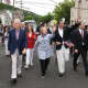 Chappaqua's Bill and Hillary Clinton with fellow Town of New Castle resident, Gov. Andrew Cuomo, marching in the New Castle Memorial Day Parade.