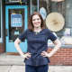 Betsy Helmuth outside her Dobbs Ferry store, which also serves as her podcast studio.