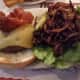 The Celsus Burger served at North Salem's The Blazer Pub is topped with melted Swiss cheese and bacon.