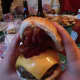 Eating the bacon-cheese burger with a "little" extra b at The Blazer Pub in North Salem takes a two-handed approach.
